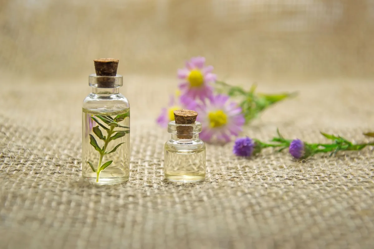 Variety of essential oil bottles displayed for cellulite treatment