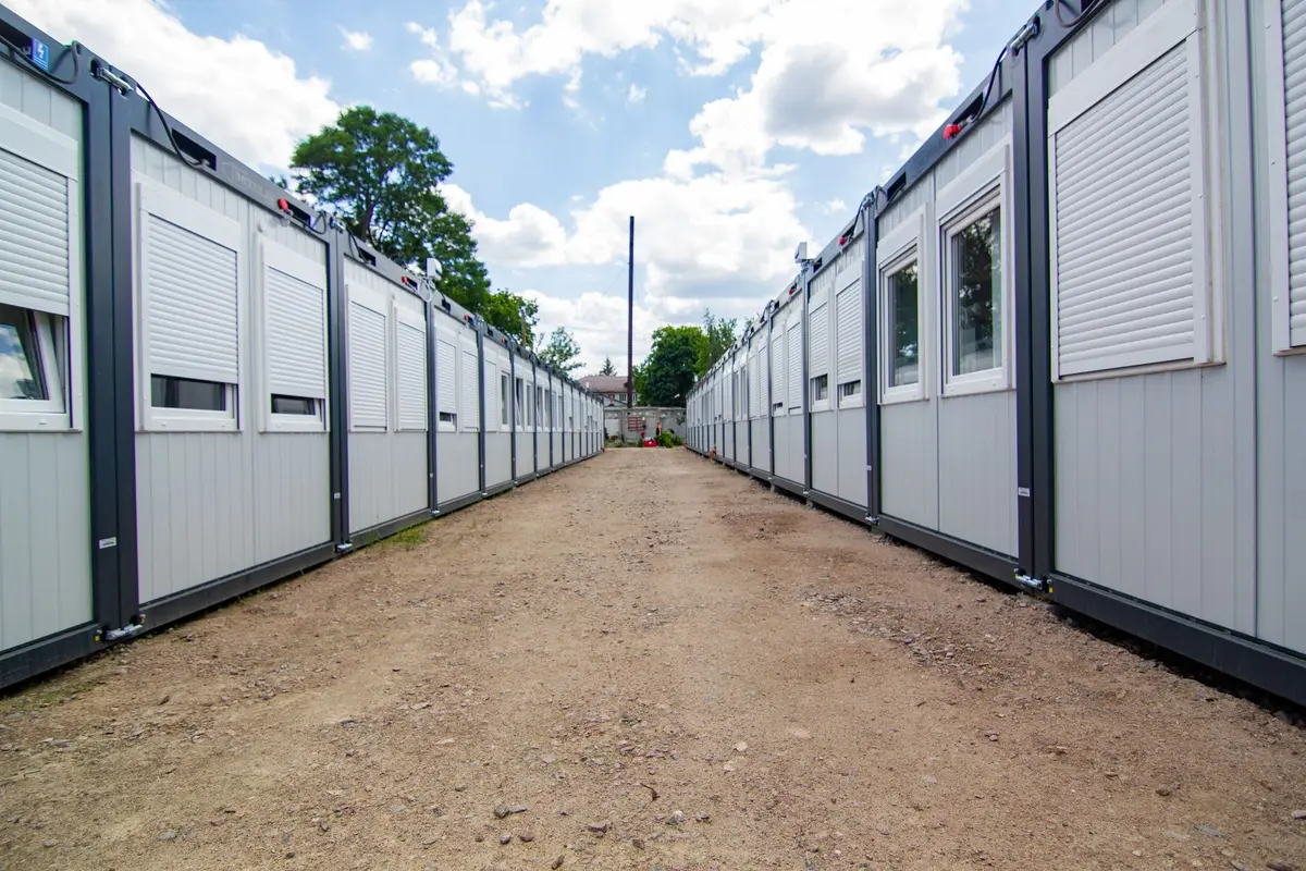 Construction equipment and temporary structures amid partially rebuilt buildings