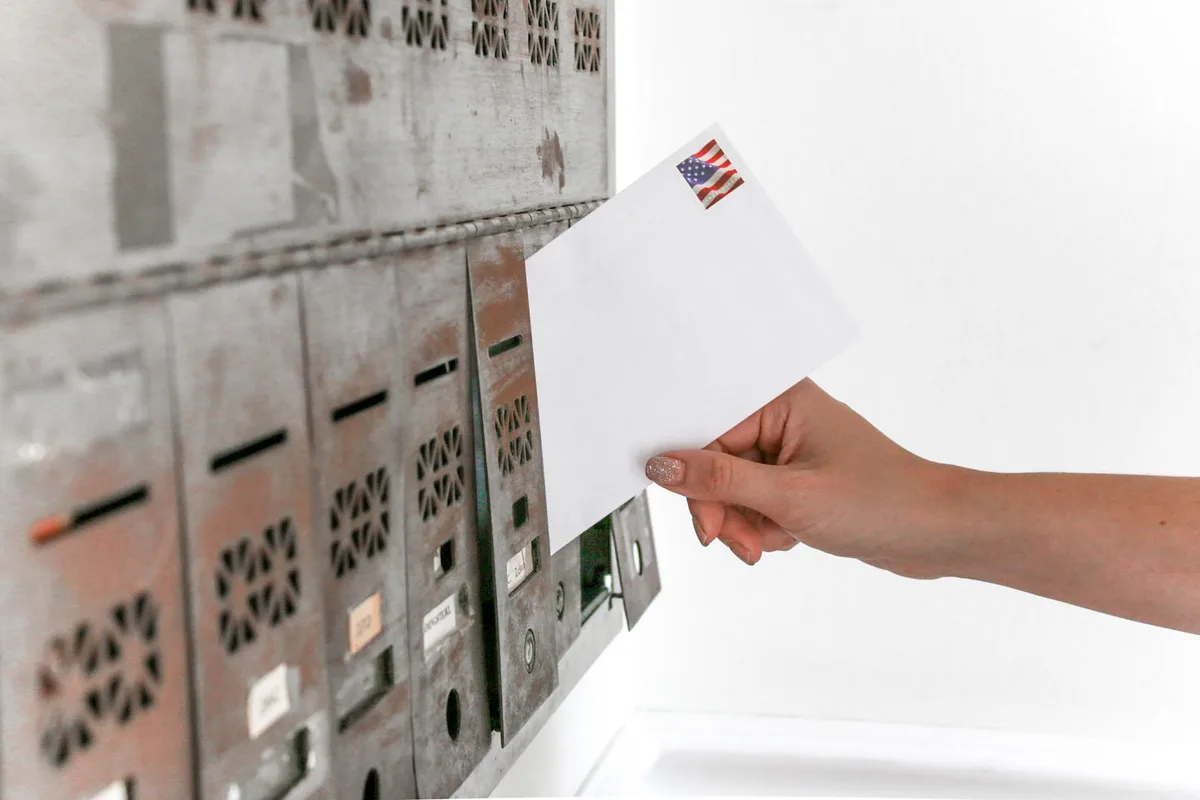 Mail-in ballot envelope being processed at a postal facility