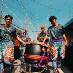Vibrant street parade with colorful costumes and dancers celebrating in an urban neighborhood setting