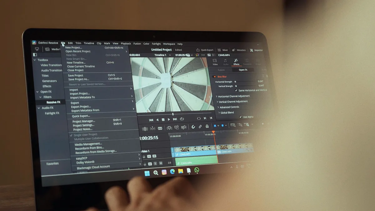 Film director working with archival footage and montage editing materials