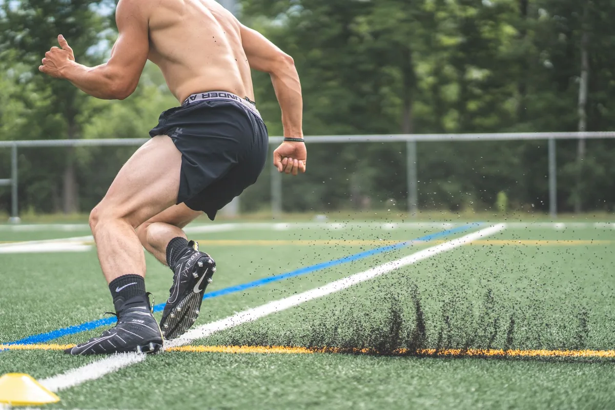 NFL player demonstrating athletic prowess during training or game preparation