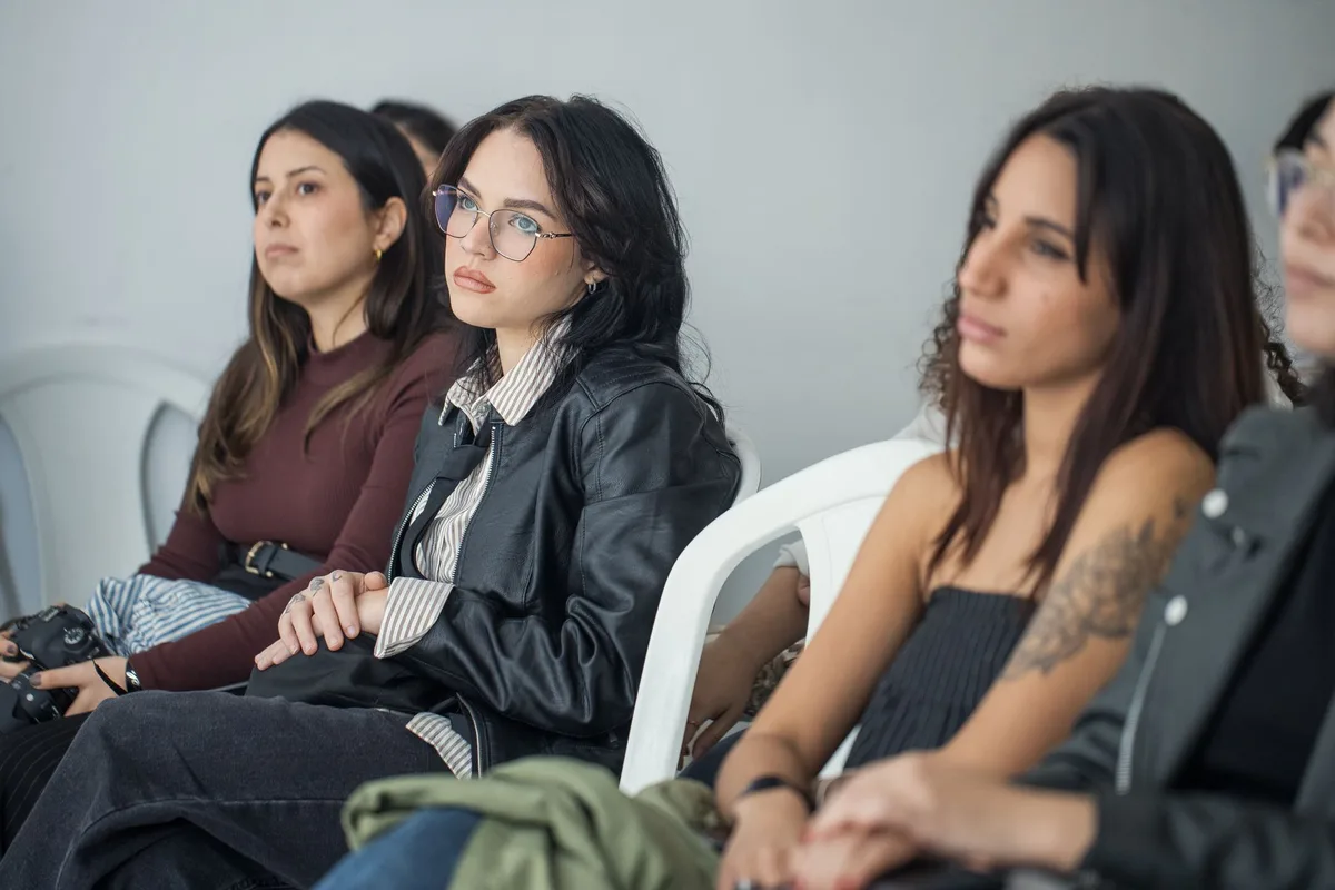 Students and emerging filmmakers engaged in conversation at an industry networking event.