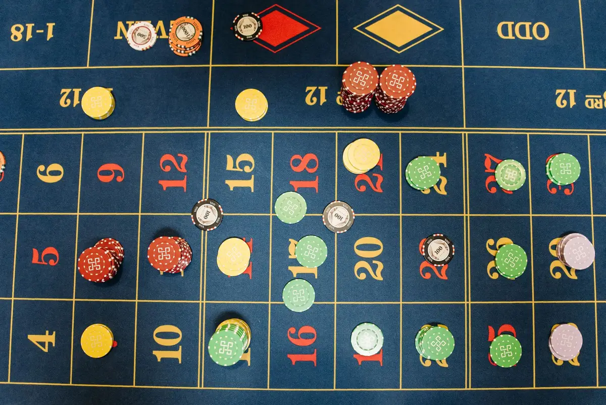 Close-up of sports betting odds displayed on a digital screen