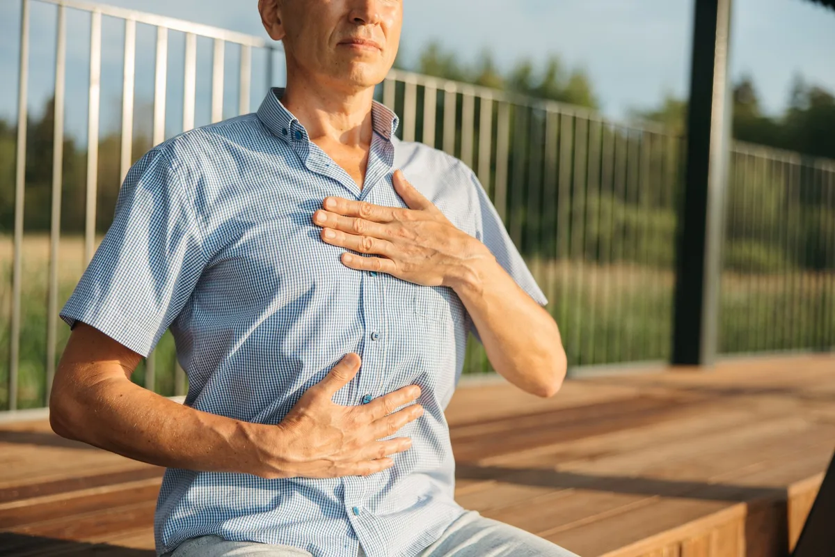 Person practicing meditation and mindfulness for stress management