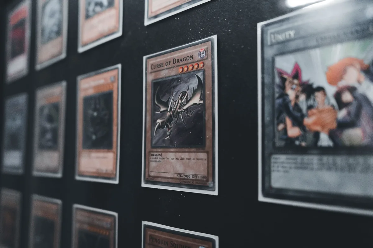 Colorful trading cards fanned out under bright lighting