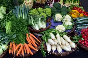Empty market stall with overturned crates and scattered grain sacks symbolising food shortages