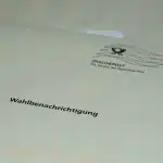 Votersmarking ballots at a polling station during parliamentary elections