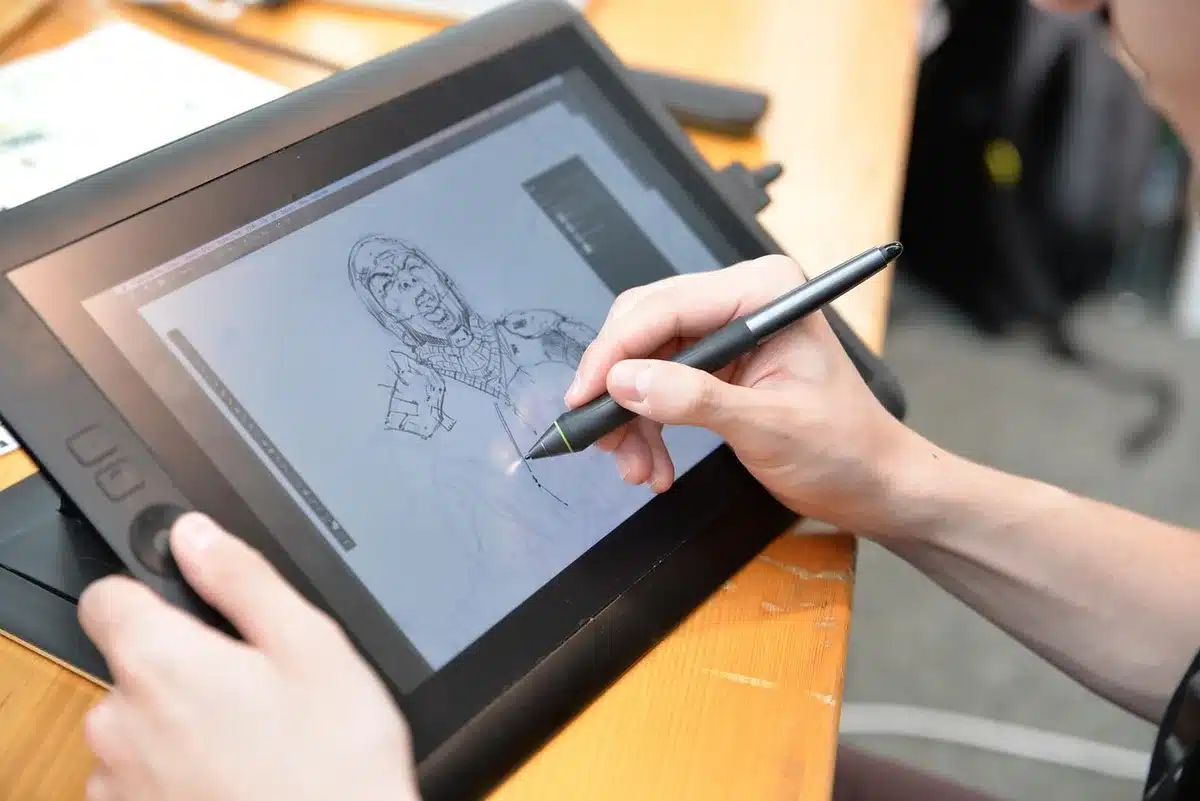 Anonymous hands adjusting servers beside a tablet with configuration interface